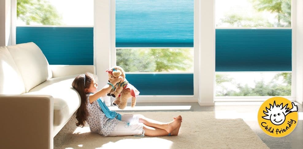child playing with stuffed animal
